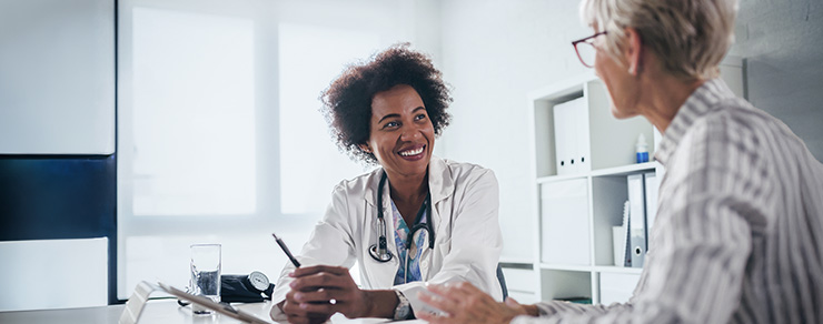 A doctor smiling at her patient